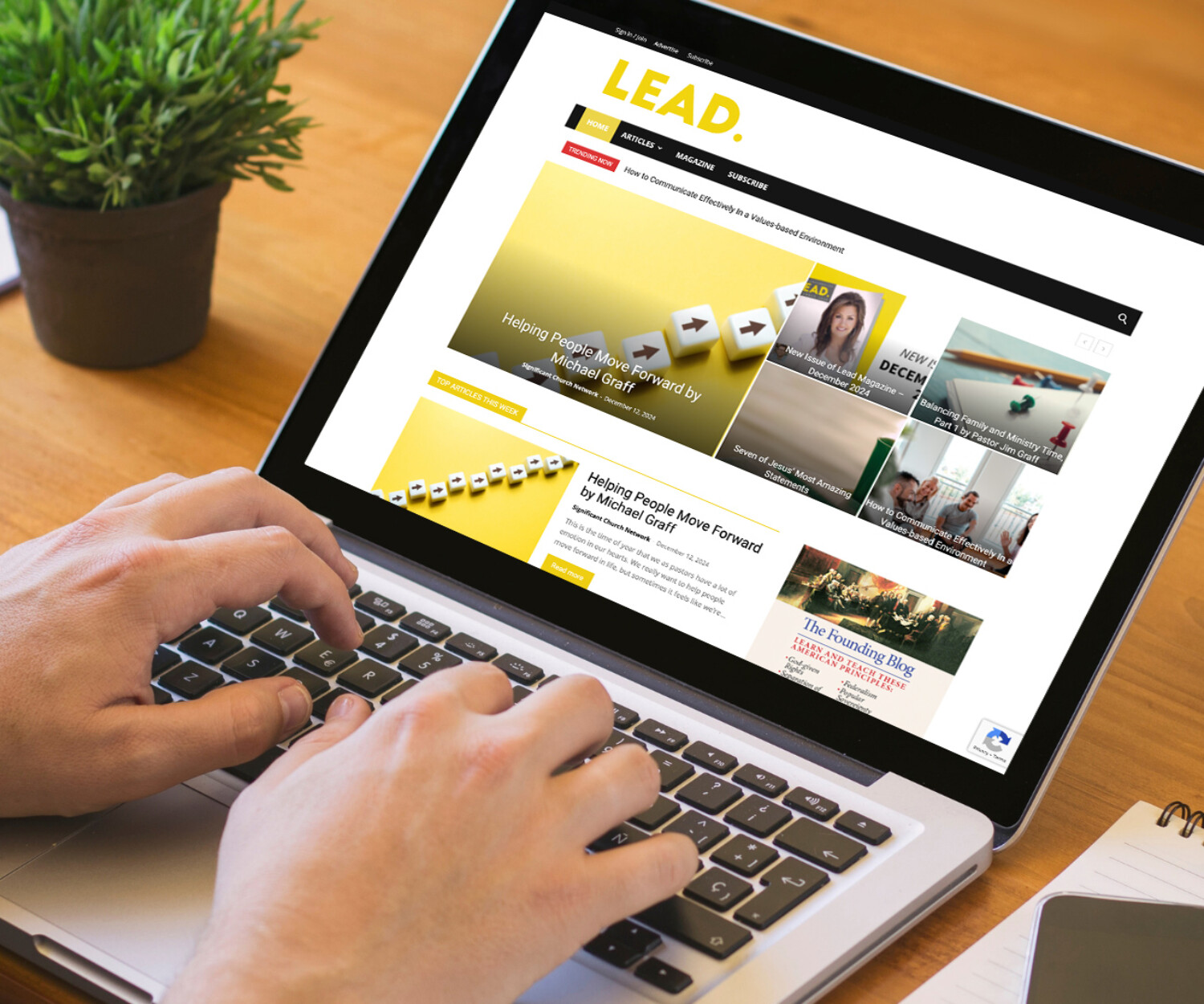 Computer viewing LEAD magazine