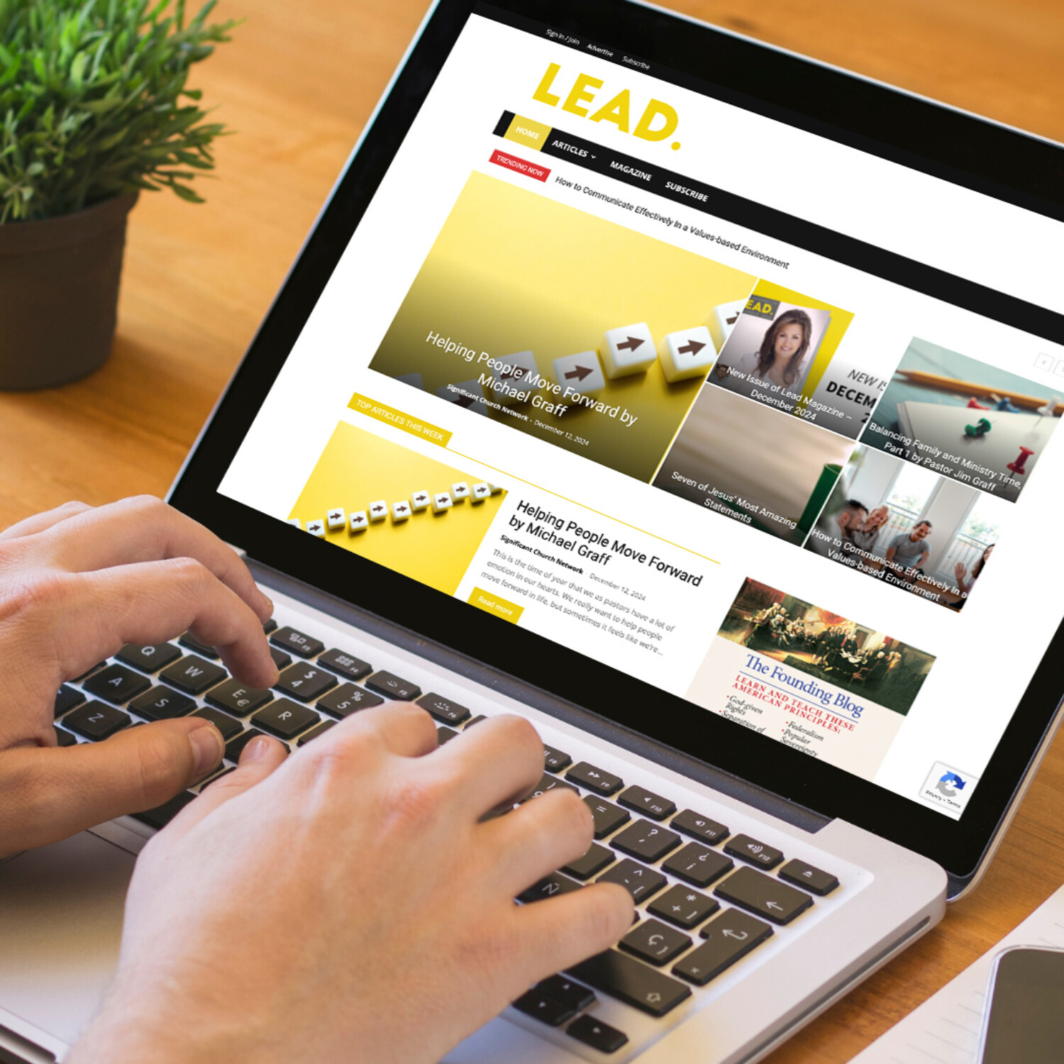 Computer viewing LEAD magazine