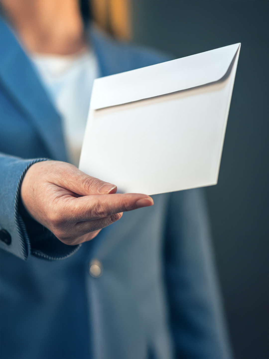 Woman handing letter